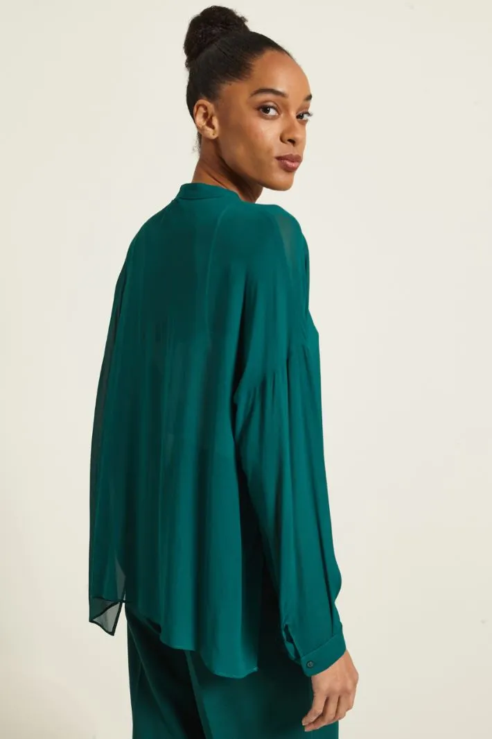 Blusa con spacchi laterali